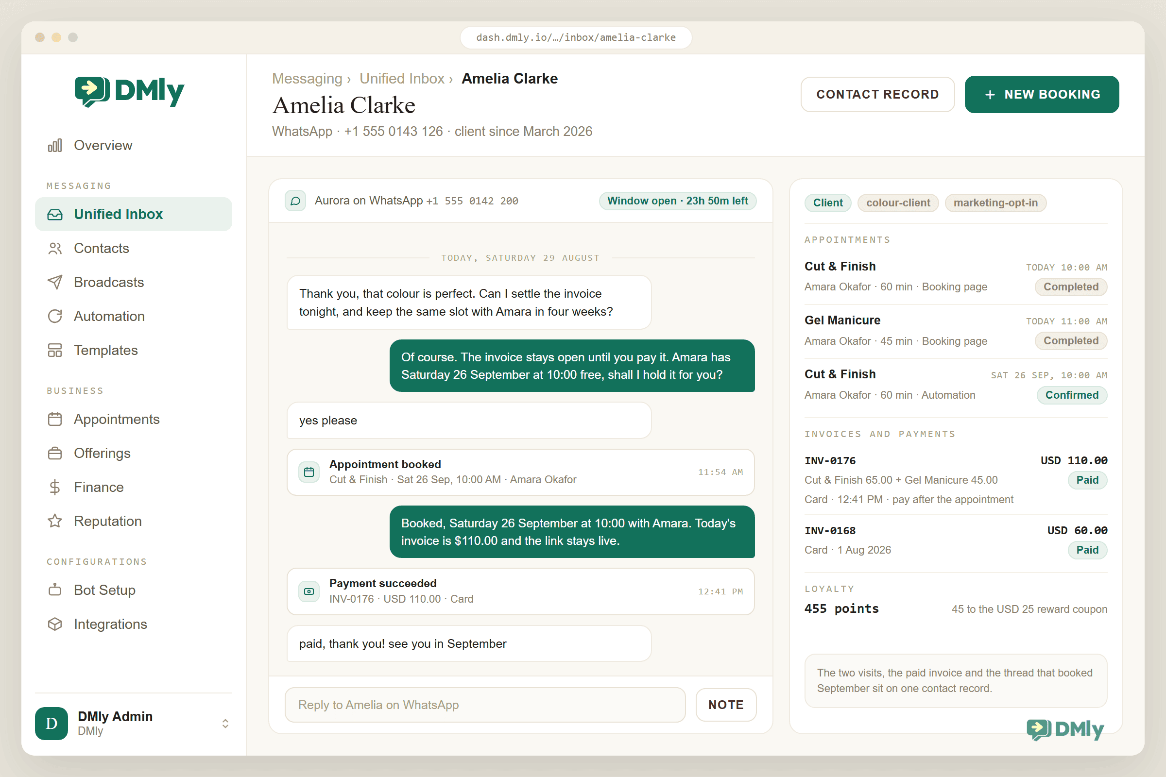 The DMly unified inbox open on the contact Amelia Clarke, a WhatsApp client of Aurora Hair and Beauty reached on +1 555 0143 126. The thread runs down the left under a strip naming the channel, Aurora on WhatsApp at +1 555 0142 200, with a chip reading Window open, 23h 50m left. She writes that the colour is perfect and asks whether she can settle the invoice tonight and keep the same slot with Amara in four weeks; the salon replies that the invoice stays open until she pays it and that Amara has Saturday 26 September at 10:00 free; she answers yes please. Two event rows sit inline in the same thread: Appointment booked, Cut and Finish on Saturday 26 September at 10:00 AM with Amara Okafor, at 11:54 AM, and Payment succeeded, INV-0176, USD 110.00, Card, at 12:41 PM, with a confirmation message between them and a final note from her reading paid, thank you, see you in September. The contact rail on the right is tagged Client, colour-client and marketing-opt-in, and lists three appointments, Cut and Finish today at 10:00 AM with Amara Okafor for 60 minutes from the booking page marked Completed, Gel Manicure today at 11:00 AM for 45 minutes marked Completed, and Cut and Finish on Saturday 26 September at 10:00 AM marked Confirmed and sourced from Automation. Under it, invoices and payments show INV-0176 at USD 110.00, itemised as Cut and Finish 65.00 plus Gel Manicure 45.00, paid by card at 12:41 PM on the pay after the appointment mode, and INV-0168 at USD 60.00 paid by card on 1 August 2026. A loyalty line reads 455 points, 45 to the USD 25 reward coupon, and a note at the foot says the two visits, the paid invoice and the thread that booked September sit on one contact record.